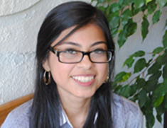 girl with glasses smiling 