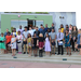 group of 20 plus students with adult advisors all standing on outside stairs posing for camera