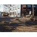 Tire tracks crossing back and forth in the dirt as construction begins