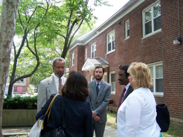 3 men and 2 women talking