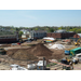 Large pile of dirt in the center of the site