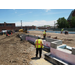 Construction workers start laying out the building footprint