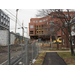 A chain link fence surrounds the construction site