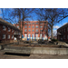 A playground in the middle of a courtyard with the 20 Day St building construction continuing in the background 