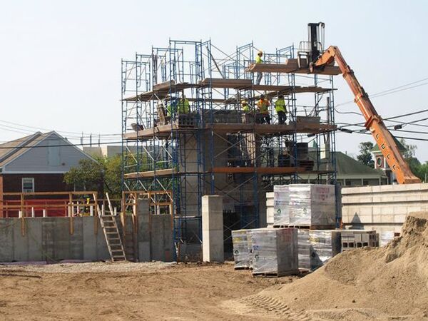 Workers are pouring an elevator shaft