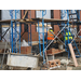 Workers continue construction on the outside of the building 