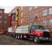 Large flat bed truck dropping off more sheetrock