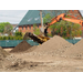 Workers uses heavy machines to pile up dirt