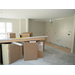 Kitchen cabinets stacked in the middle of the room