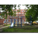 Freshly sodded playground with construction on the building happening in the background