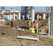 Workers installing piping 