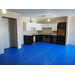 Kitchen cabinets have been installed, the flooring is being prepared to go down