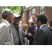 Four men in a circle talking