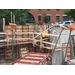 A worker working on the concrete foundation walls