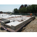 Workers lay down rebar to reinforce the concrete floor