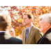 man speaking to colleagues 