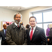 Two men smiling in suits