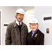  Man and woman smiling in hardhats 