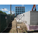 metal buttresses holding concrete wall