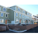 The siding and all the windows have been installed on this side of the building, brick walkways are being laid